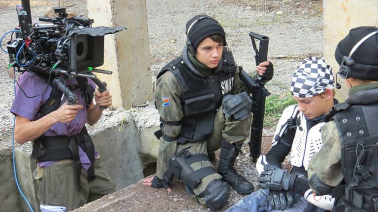 Cameraman and three young actors in a scene on day one of filming 'Samson had no muscles'