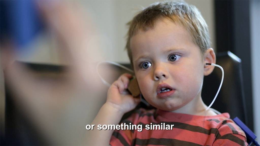 Hearing test being performed on a toddler.